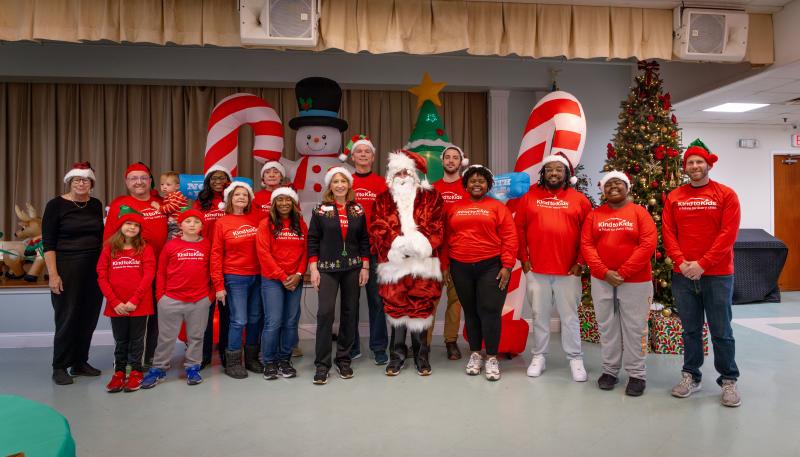 On hand to help make a success of the annual Kind to Kids holiday party are (l-r) Maryanne Murray, board member; Isaac Raser-Schramm; Erik Raser-Schramm, board member; Elijah Raser-Schramm; Abram Raser-Schramm; Izuru Osegbu; Jeanette DeBright; Wendy Hannon; Jeanne Chiquoine; Caroline Jones, president and founder; Mark Jones, board member; Michael Sullivan as Santa; Patrick Whelan; Letreece Rhodie Pitts; Keyon Pitts; Jeremiah Pitts; and Dave Arthur, board member. SUBMITTED PHOTOS
